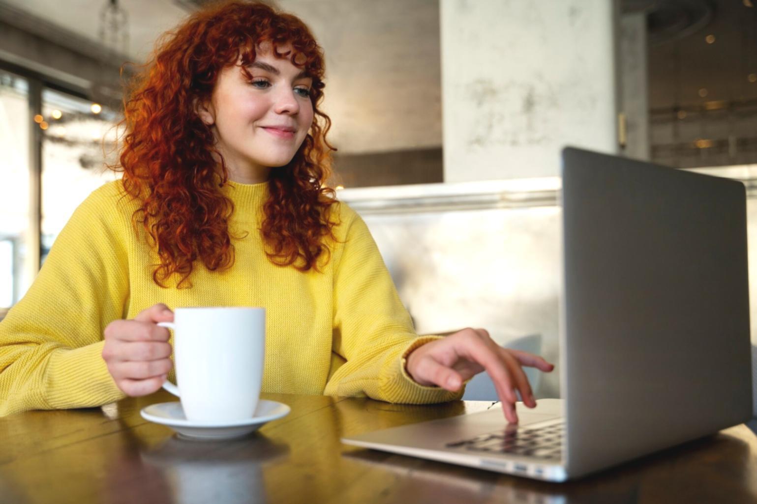 Budget planning workspace with coffee and notebook